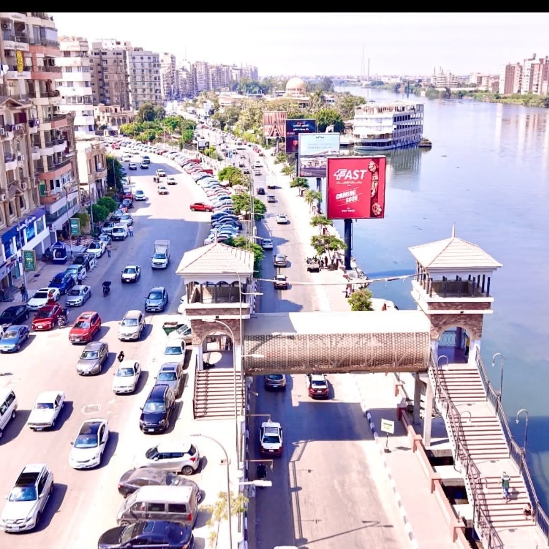 Aerial view of the Mansoura corniche with an Alwetr unipole beside the Nile